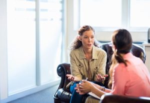 pair of women talking at dual diagnosis treatment center virginia