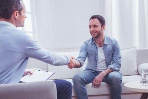 patient shaking therapist hand at virginia psychiatric counseling center programs