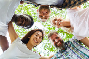 group in hug circle at alcohol addiction treatment program va