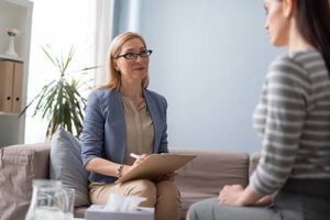 a doctor explaining to a patient how psychological testing works