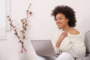 woman using laptop for telehealth appointments