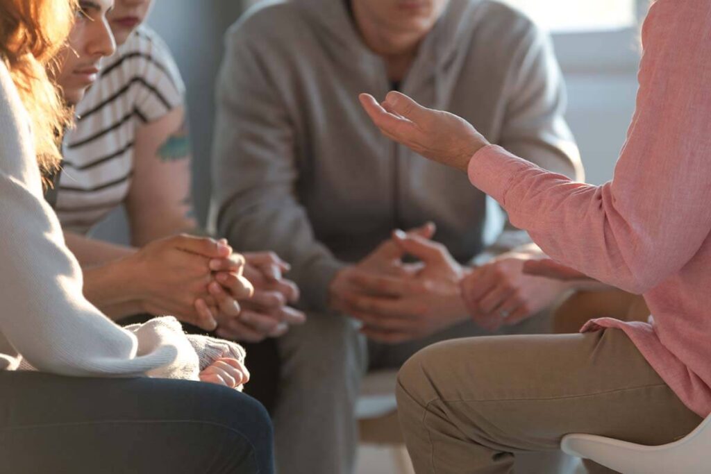 individuals talking in support group