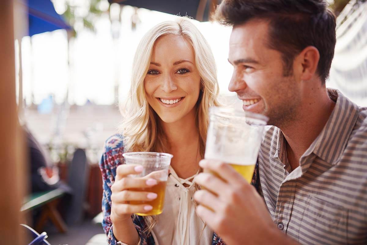a happy couple enjoys alcohol in moderation
