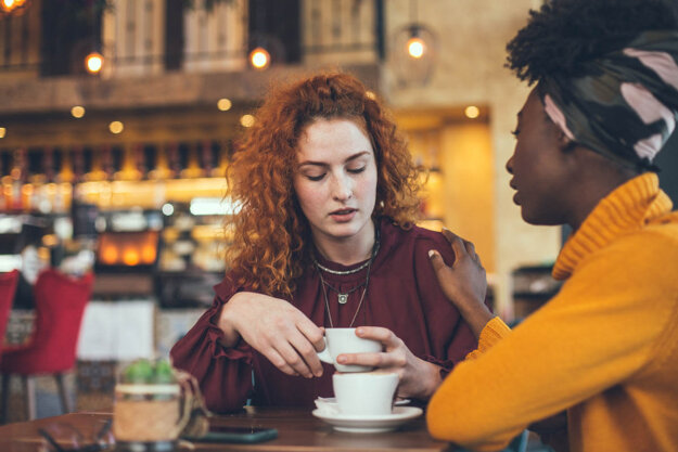 How to Repair Broken Trust in a Relationship Friends at cafe discussing broken trust in a relationship