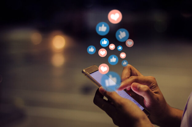 Is There a Link Between Social Media and Anxiety _ Person on phone using social media app to illustrate the link between social media and anxiety