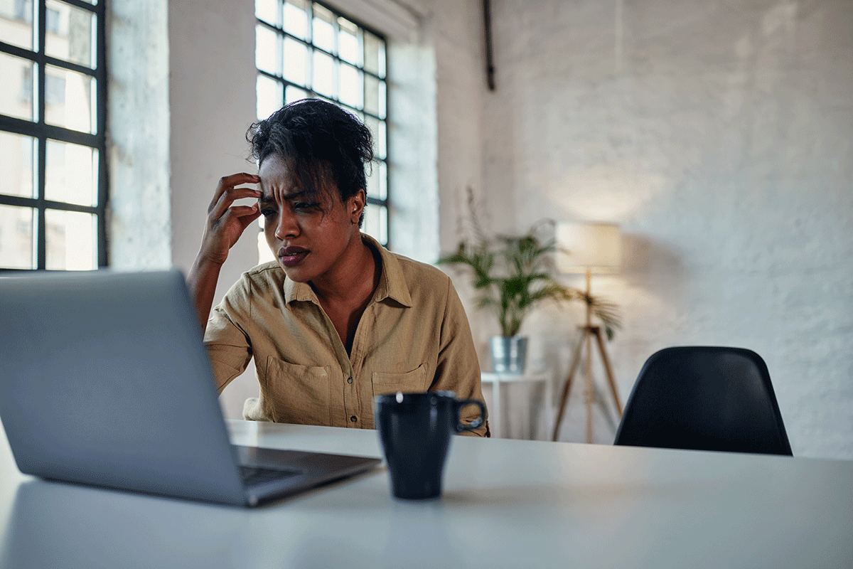 The-Science-Behind-Process-Addictions person using laptop to research the science behind process addictions