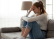 A woman wondering, "What triggers an anxiety attack?"